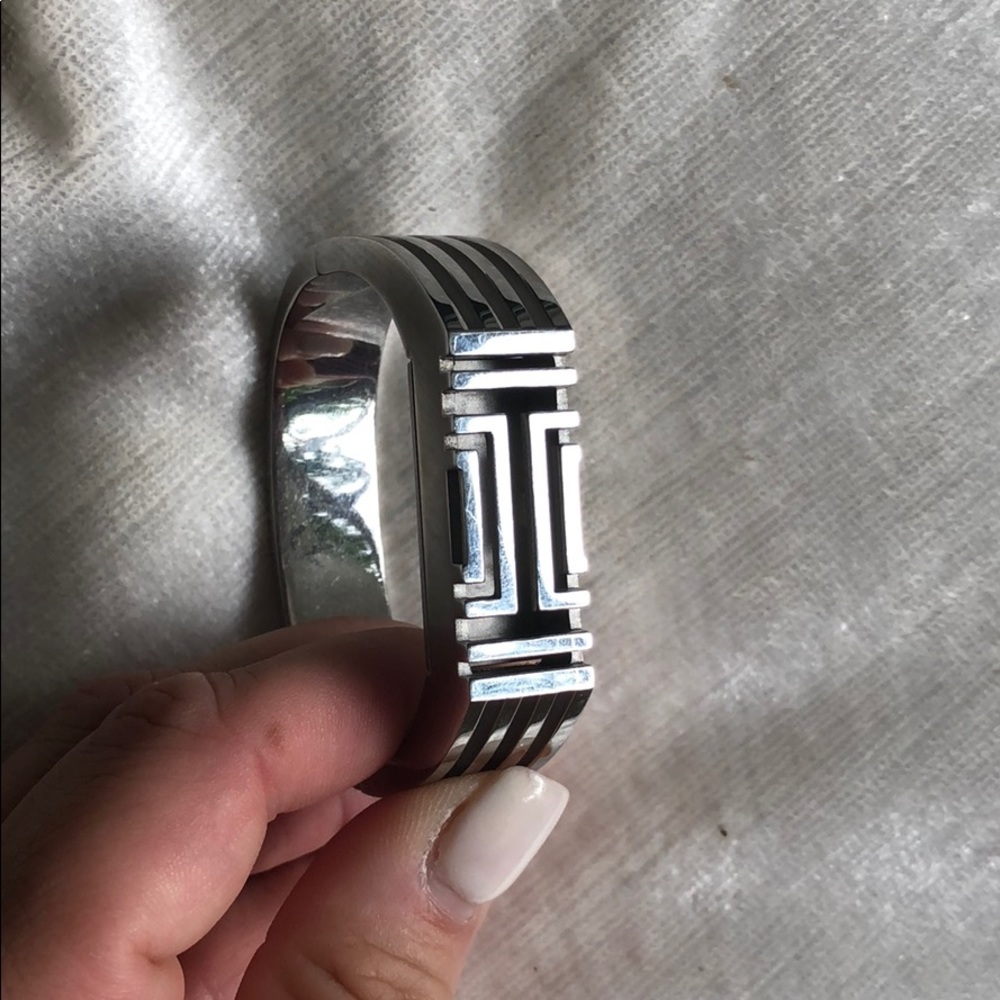 Silver Tory Burch fit bit bracelet.